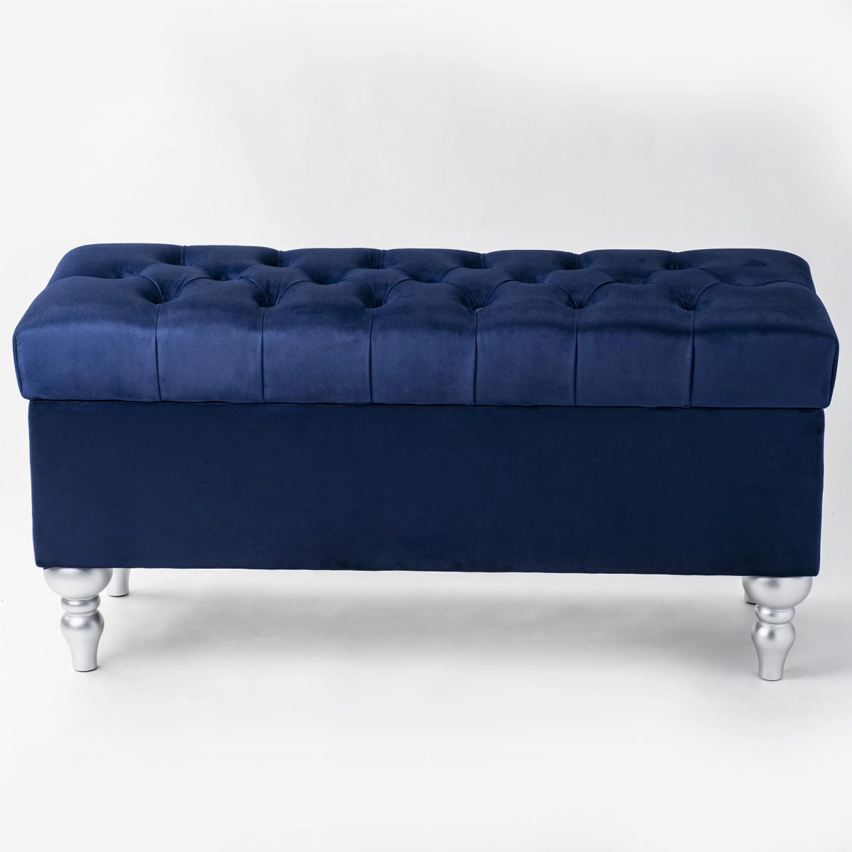 Pouf bleu marine avec rangement et matelassage, parfait pour les intérieurs modernes