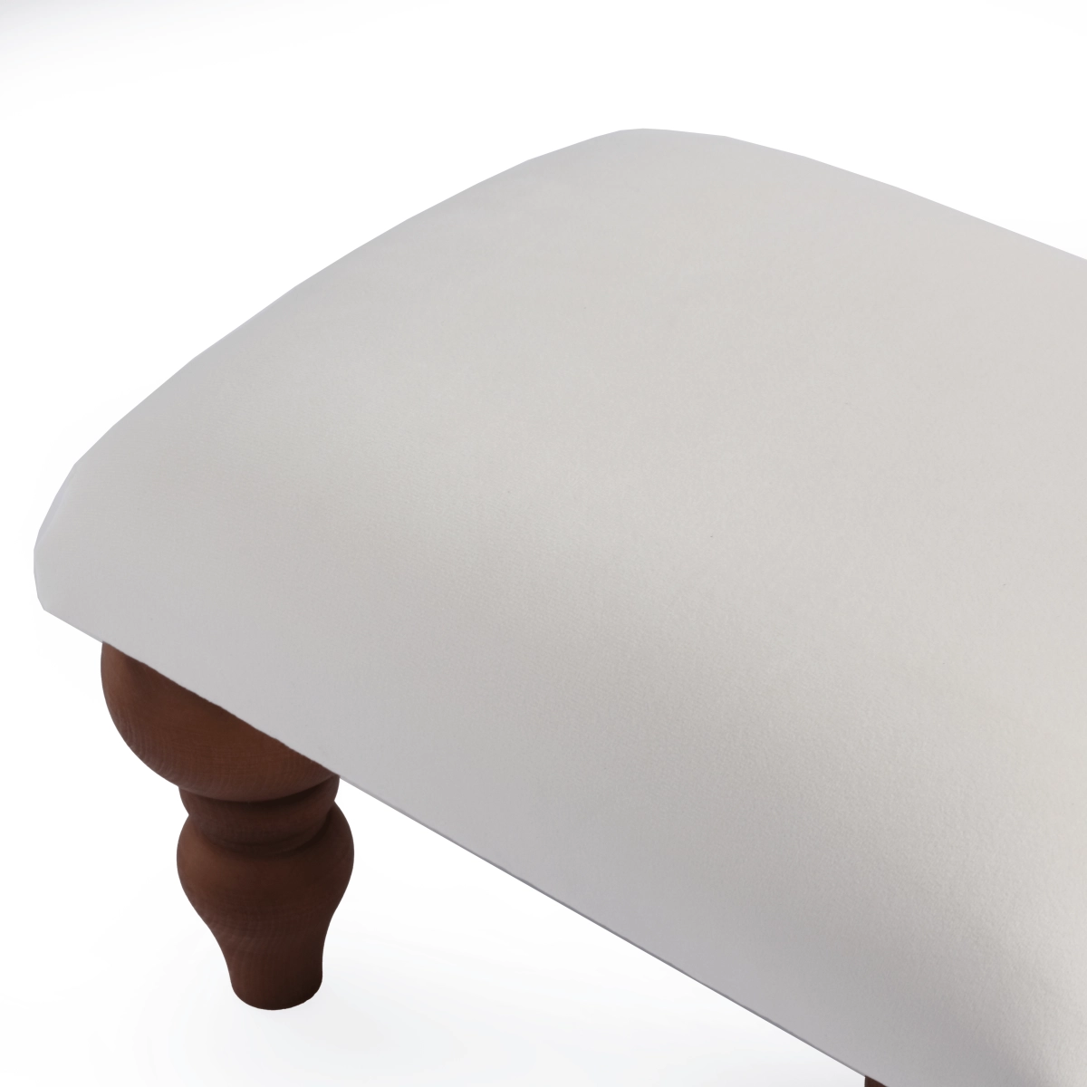 Un repose-pieds blanc confortable, un ajout élégant au fauteuil du salon