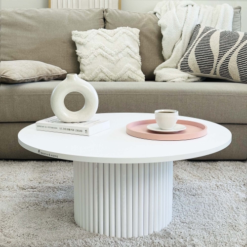 Table basse ronde beige avec pied rainuré