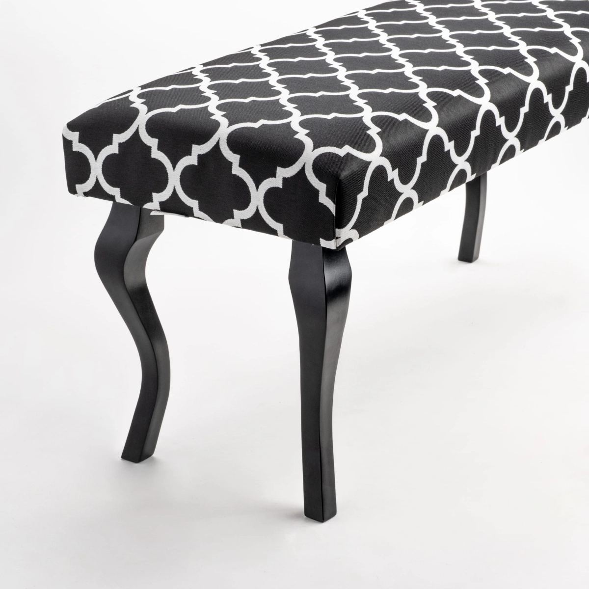 Banc à motifs avec assise rembourrée et pieds en bois noir