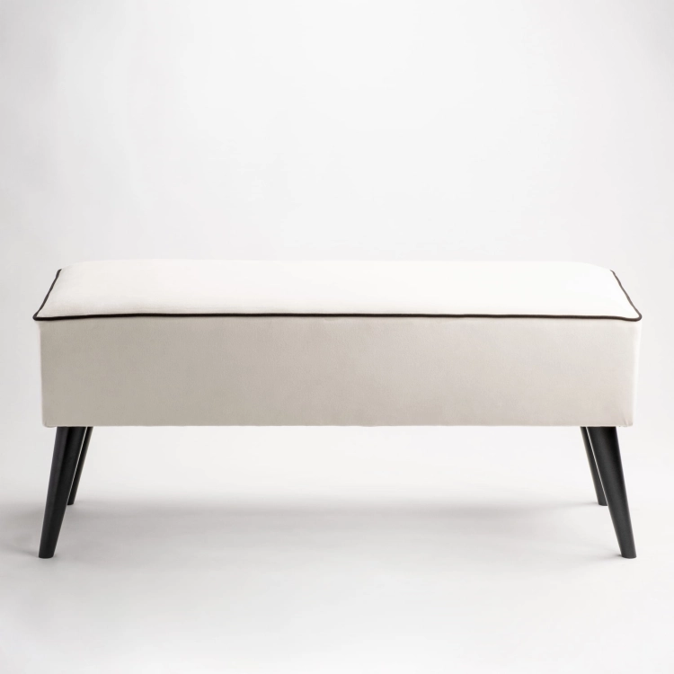 Banc rembourré crème avec pieds noirs pour le couloir