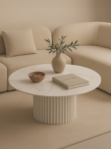 Table ronde blanche avec plateau en pierre et base rainurée décorative