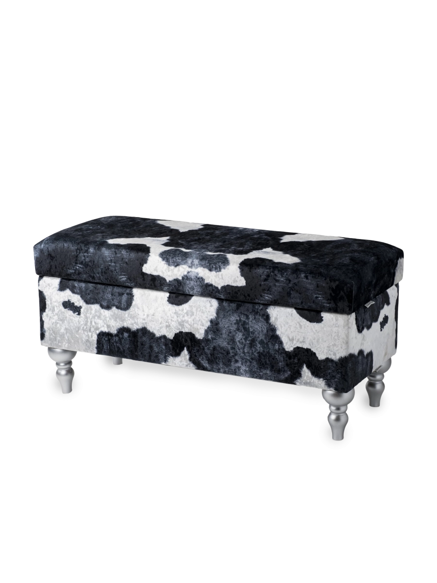 Un pouf avec compartiment de rangement tapissé d'un motif vache, confortable et décoratif pour l'intérieur