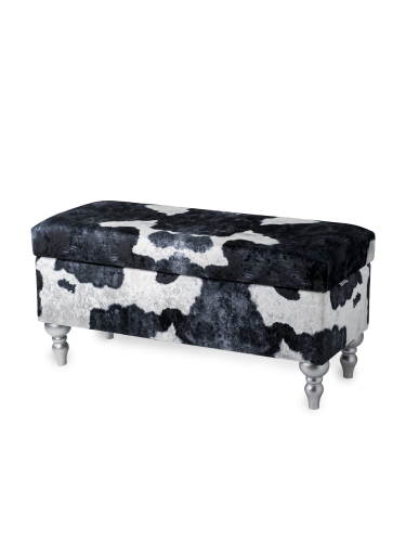Un pouf avec compartiment de rangement tapissé d'un motif vache, confortable et décoratif pour l'intérieur