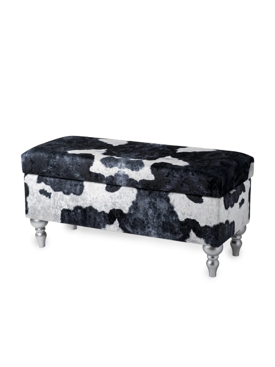 Un pouf avec compartiment de rangement tapissé d'un motif vache, confortable et décoratif pour l'intérieur