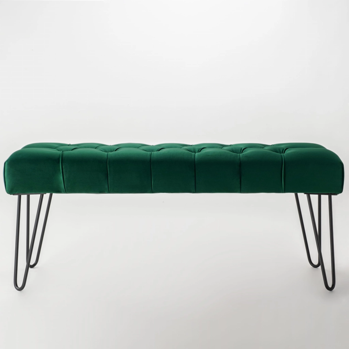 Banc vert matelassé sur pieds en métal